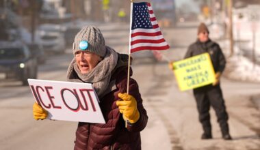 Rosie Grutze protests the presence of the U.S. Immigration and Customs Enforcement, Wednesday in Portland, Maine.