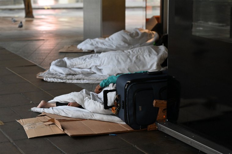 Rough sleepers lay in their makeshift beds and camps outside closed shops, at daybreak on Oxford Street in London on August 2, 2023. A report released by the Combined Homelessness and Information Network (Chain) on July 31, 2023, found that the number of new people sleeping rough in London in spring and early summer had risen by 12% on the same period last year. The report found that 3,272 people were recorded as sleeping rough in the capital, up 9% on the total figure for April-June 2022. (Photo by JUSTIN TALLIS / AFP) (Photo by JUSTIN TALLIS/AFP via Getty Images)