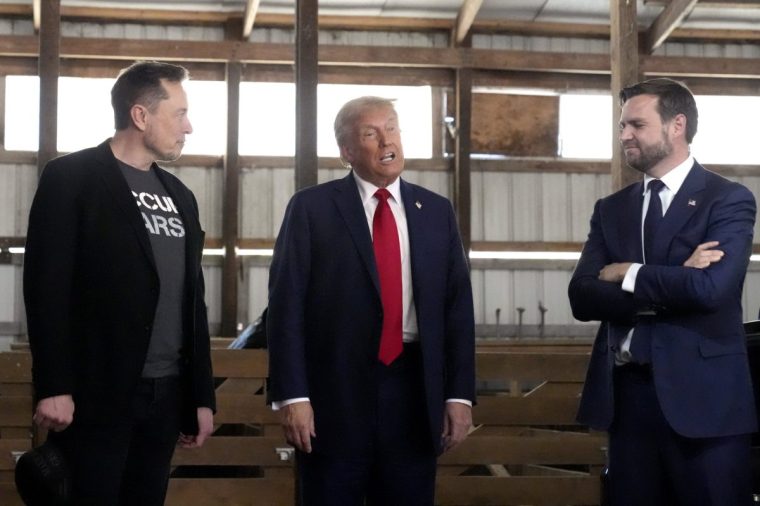 FILE - Tesla and SpaceX CEO Elon Musk, from left, Republican presidential nominee former President Donald Trump and Republican vice presidential nominee Sen. JD Vance, R-Ohio, attend a campaign event, Oct. 5, 2024, in Butler, Pa. (AP Photo/Alex Brandon, File)