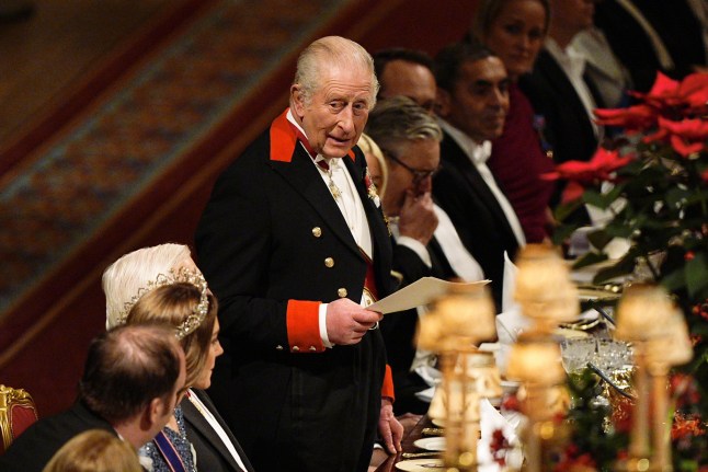WINDSOR, ENGLAND - DECEMBER 03: King Charles III gives a speech during the state banquet for the German President Frank-Walter Steinmeier and his wife Elke Budenbender, at Windsor Castle, on December 3, 2025 in Windsor, England. The President of the Federal Republic of Germany, accompanied by Ms. Elke B??denbender, are paying a State Visit to the United Kingdom as the guests of Their Majesties The King and Queen. The visit is the first from Germany in 27 years and will be marked with ceremonial visits, an address to the UK parliament and a banquet. (Photo by Aaron Chown - Pool/Getty Images)