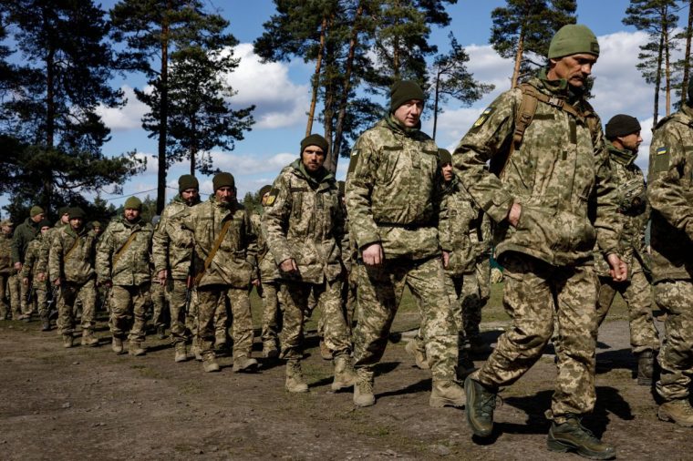 UNSPECIFIED, UKRAINE - MARCH 26: Male volunteers in military uniform at the conscription point after sign a contract with the Ukrainian army on March 26, 2024 in Unspecified, Ukraine. On 24 February 2022, Russia invaded Ukraine in an escalation of the Russian-Ukrainian War that started in 2014. (Photo by Serhii Mykhalchuk/Global Images Ukraine via Getty Images)