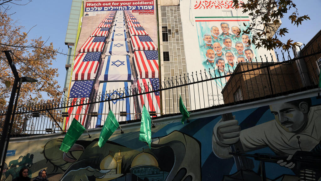 A billboard at Tehran’s Palestine Square showing coffins draped with US and Israeli flags and the words, in Hebrew and English, 'Watch out for your soldiers' (Photo: Majid Asgaripour/WANA (West Asia News Agency) via REUTERS) טהרן איראן שלט חוצות נגד ישראל ו ארה"ב