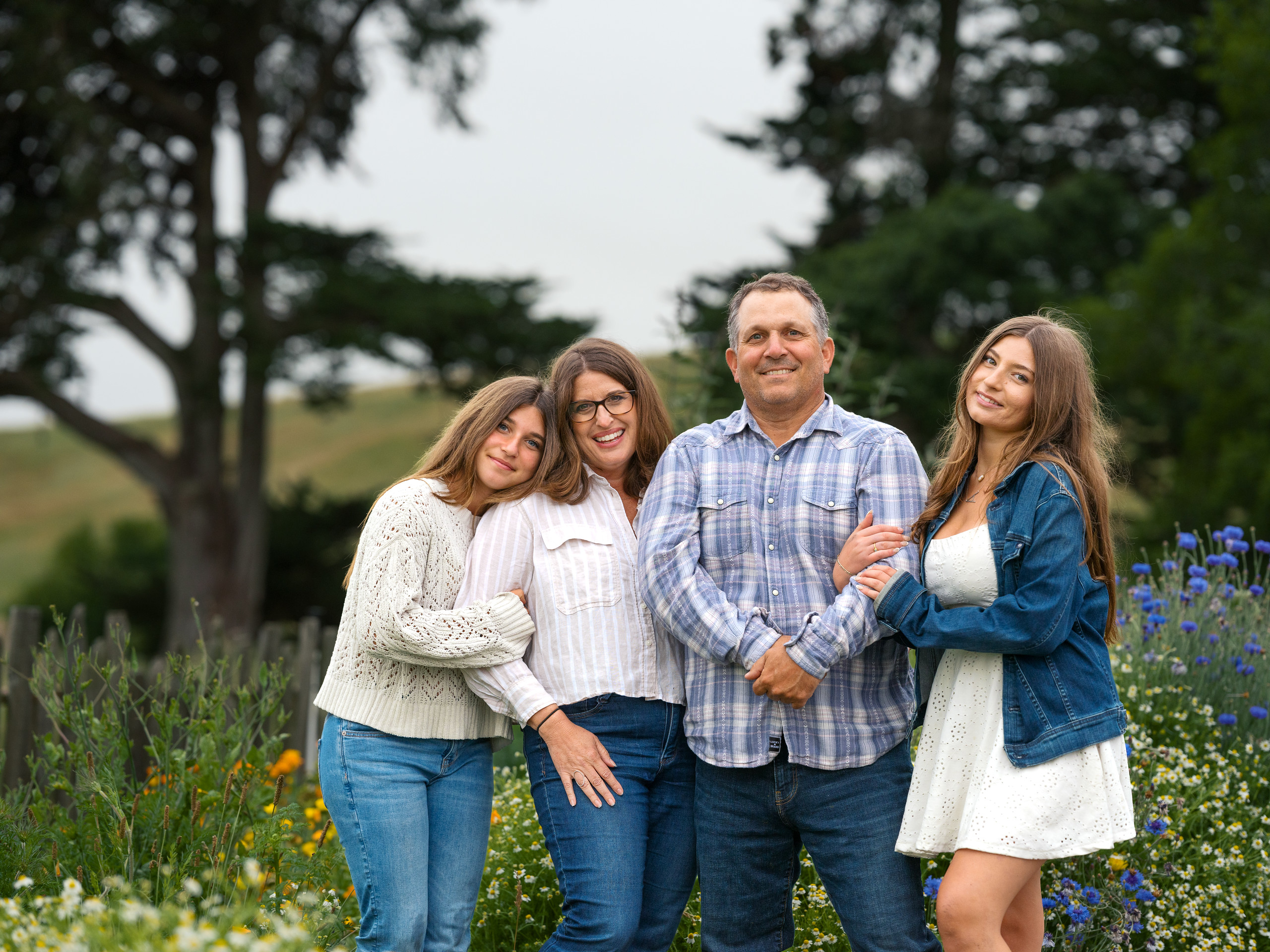 Lisa and Loren Poncia, flanked by their daughters Julianna (at...