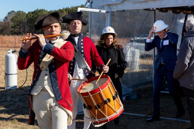 Heather Armentrout, U.S. president and general manager of Kongsberg Defence & Aerospace Inc., follows members of the Fife & Drums at the groundbreaking ceremony for the company's first American facility in James City County. (Sara Harris/Consociate Media)