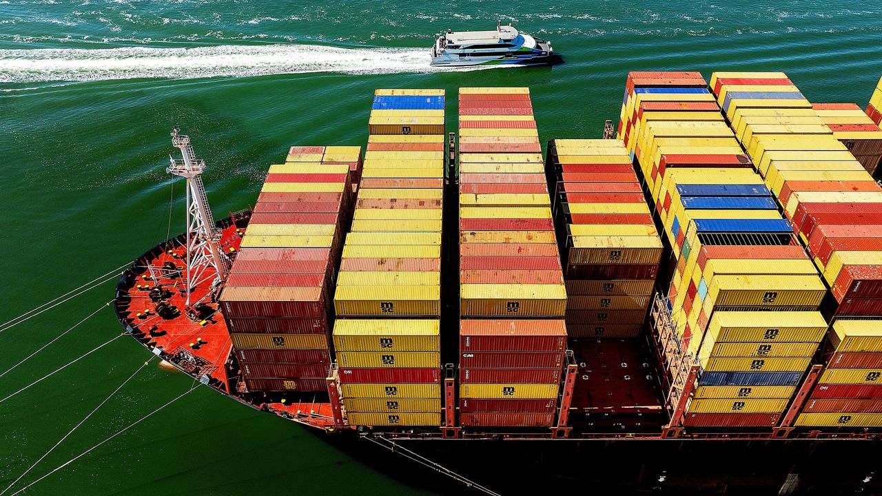 Cargo containers fill a ship at the Port of Oakland on Wednesday, Aug. 6, 2025, in Oakland, Calif. (AP Photo/Noah Berger)