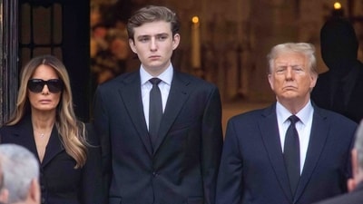 Melania Trump, Barron Trump, and President Donald Trump watch as the casket of Melania's mother Amalija Knavs is brought (via REUTER)