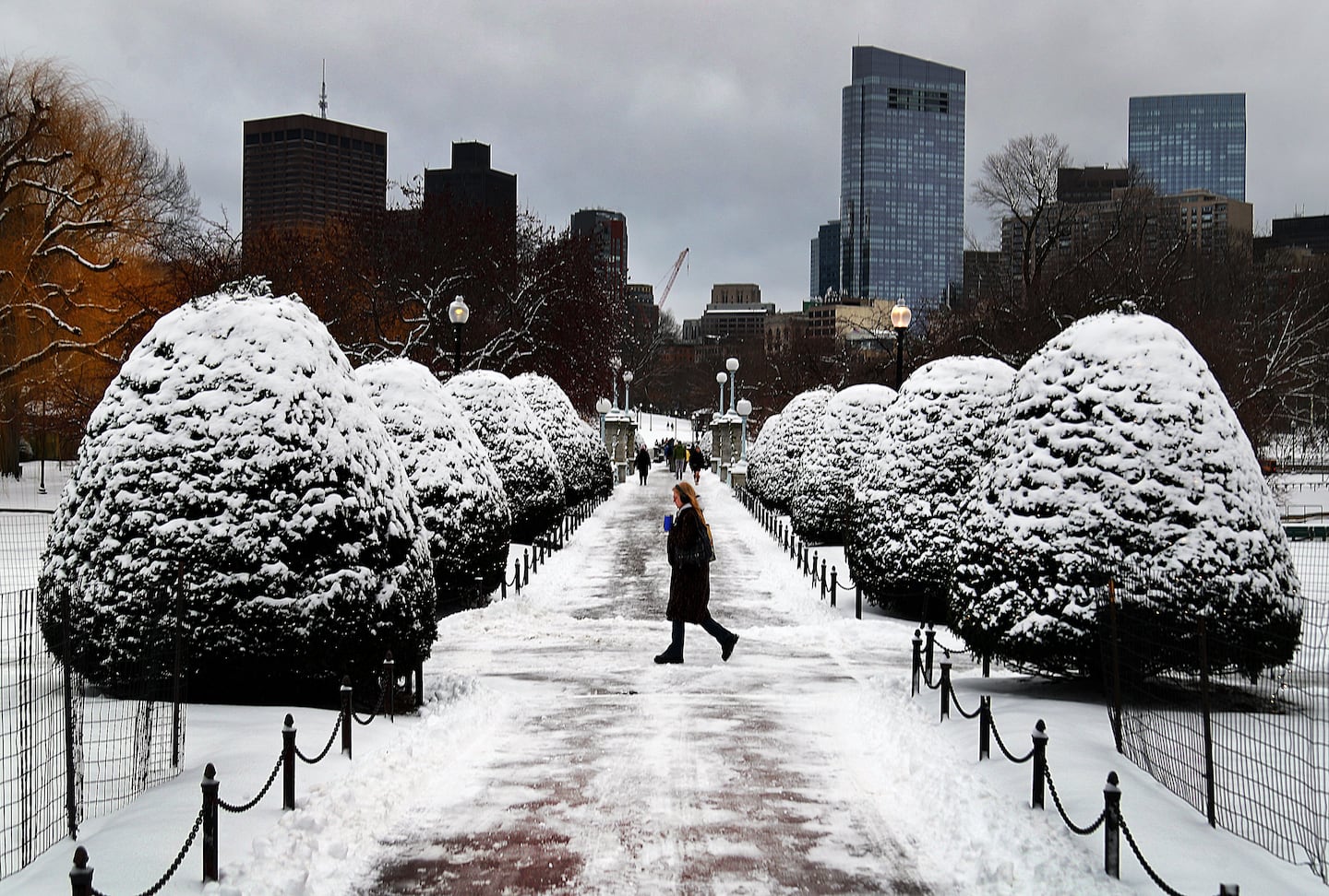 A woman walks through the Public Garden in Boston on Dec. 27.