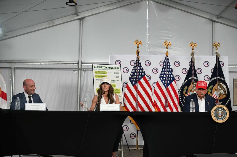 Kristi Noem, President Donald Trump and Stephen Miller