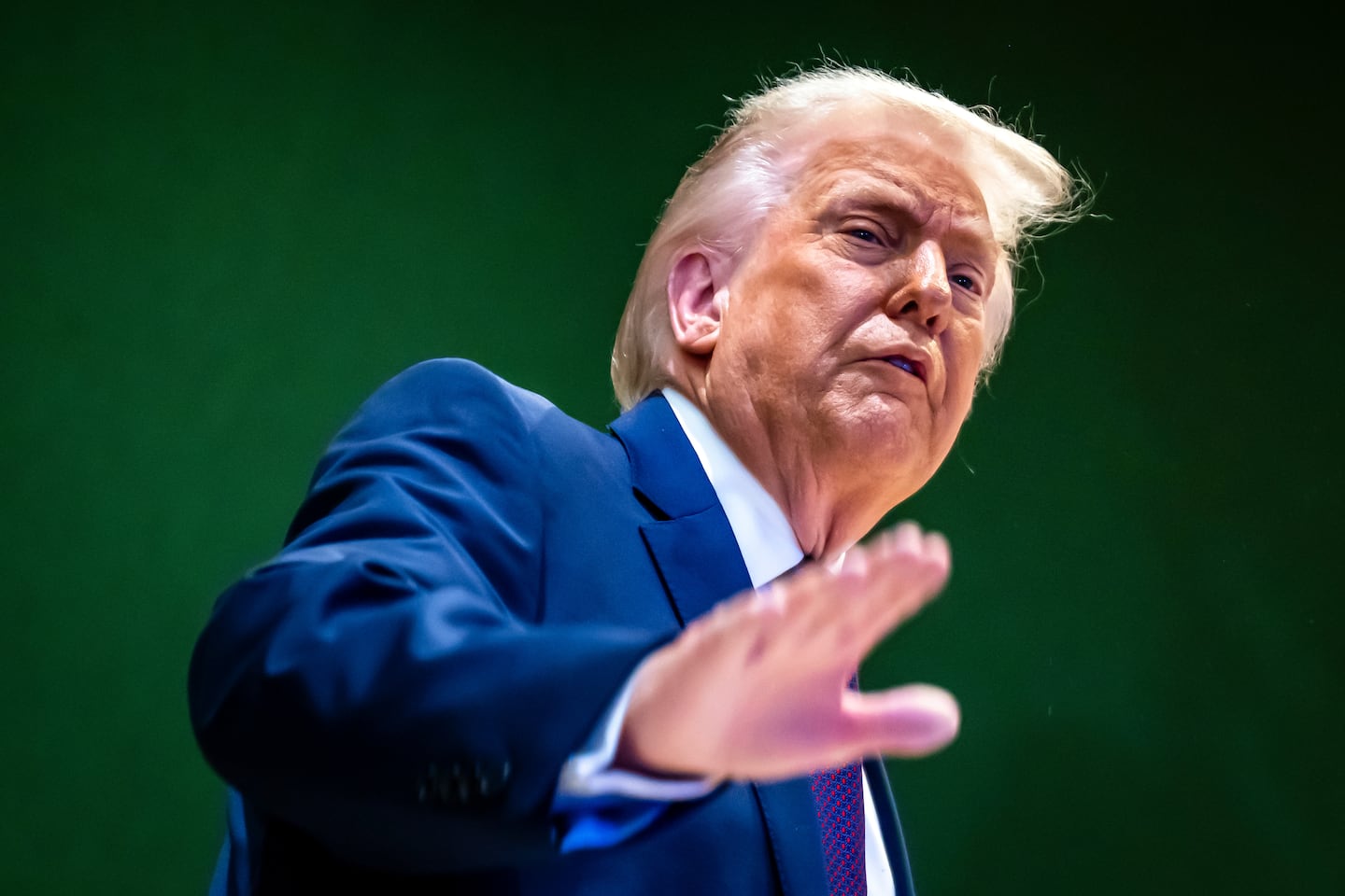 US President Trump gestures as he climbs a staircase after a signing ceremony of his Board of Peace initiative at the Annual Meeting of the World Economic Forum in Davos, Switzerland, Thursday, Jan. 22, 2026. 
