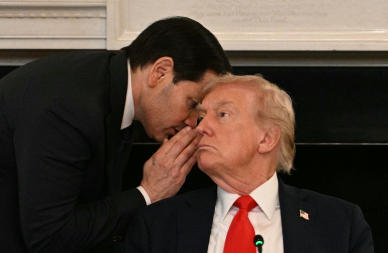 AFP PICTURES OF THE YEAR 2025 US Secretary of State Marco Rubio whispers in the ear of President Donald Trump during a roundtable about Antifa in the State Dining Room of the White House in Washington, DC, on October 8, 2025. (Photo by Jim WATSON / AFP) / NO USE AFTER JANUARY 31, 2026 23:00:00 GMT - AFP PICTURES OF THE YEAR 2025