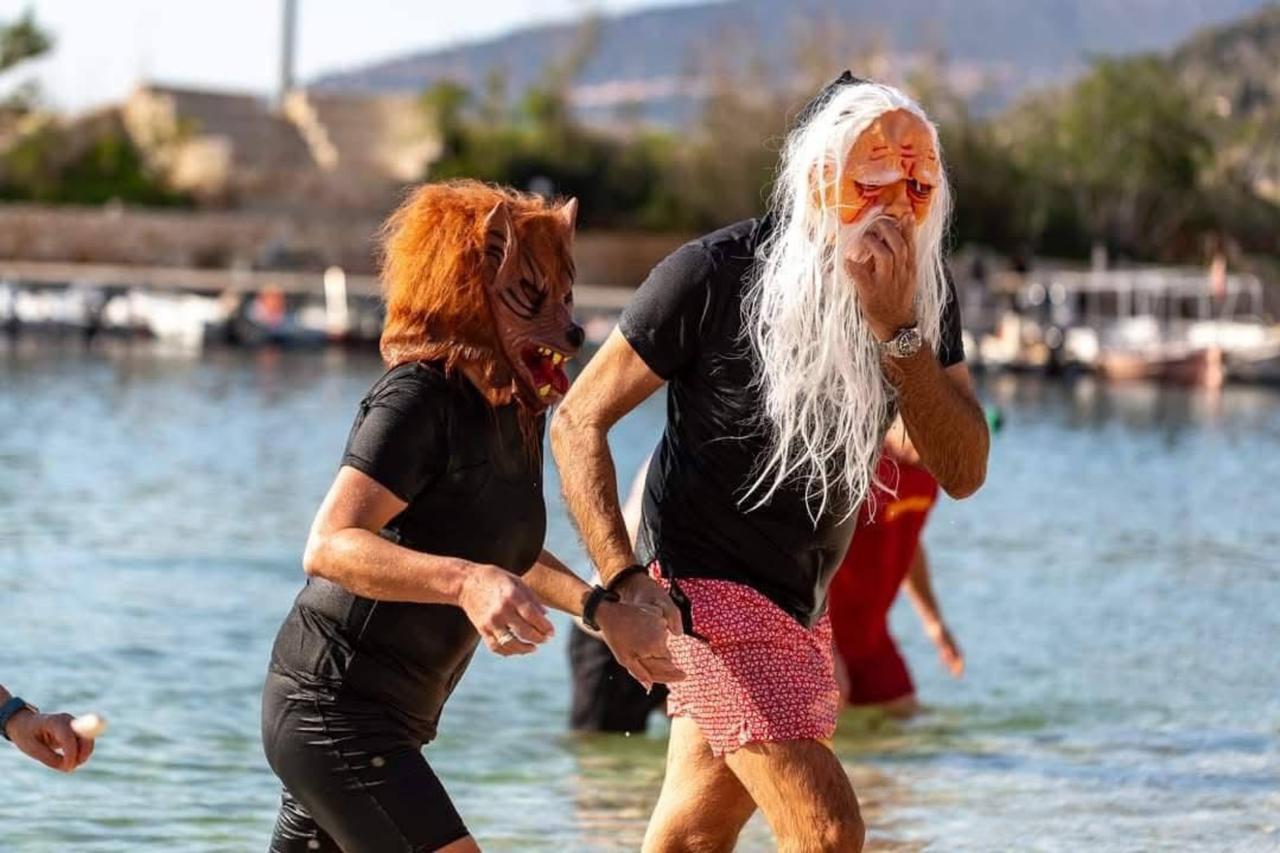 Foreign residents wearing eye-catching costumes swim and walk in the sea during New Year celebrations in Antalya’s Kas district, Türkiye, Jan. 2, 2026. (AA Photo)