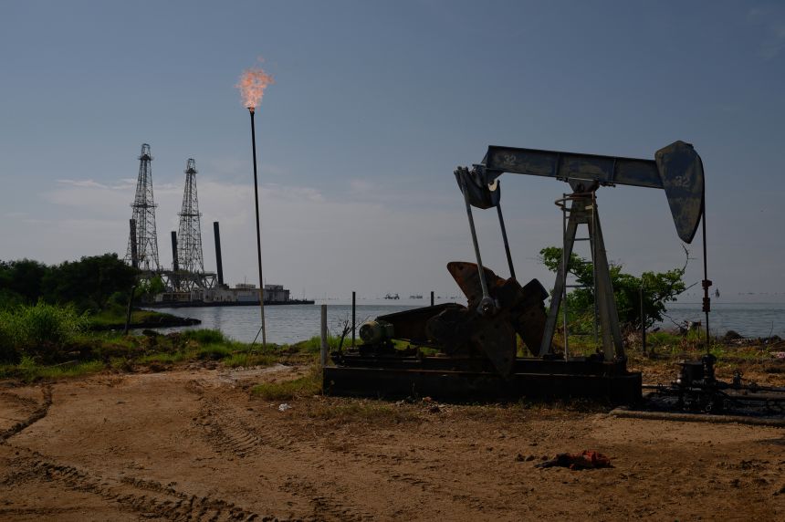 A Petroleos de Venezuela SA (PDVSA) oil pumpjack on Lake Maracaibo in Cabimas, Zulia state, Venezuela, on November 17, 2023.