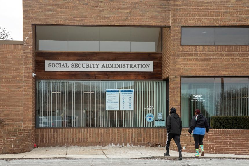People enter a social security administration office in St. Clair Shores, Michigan, in March 2025.