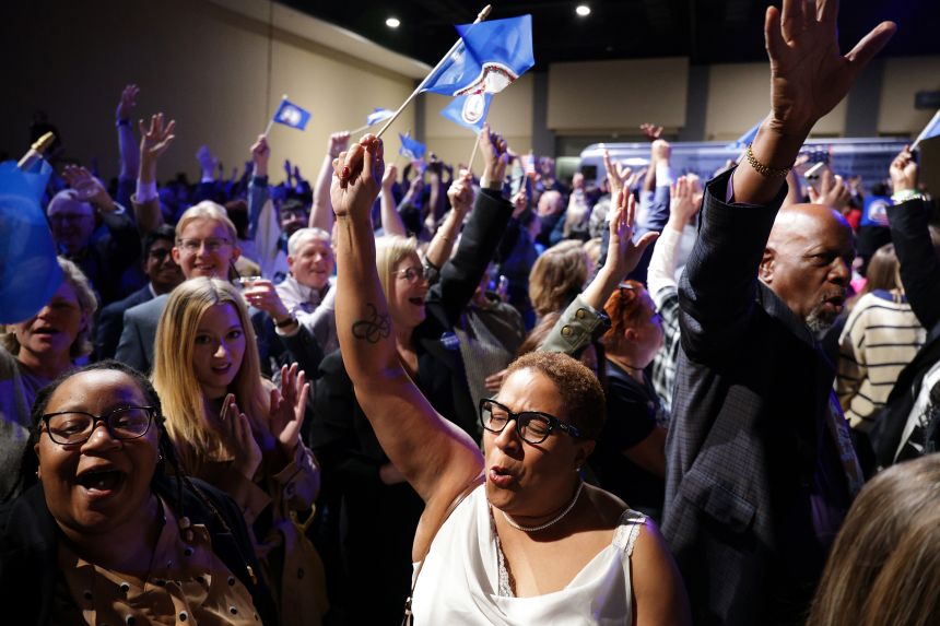 Supporters celebrate during the election night watch party for Virginia Democratic gubernatorial candidate, former Rep. Abigail Spanberger as she is projected to win the race at the Greater Richmond Convention Center on November 4, 2025 in Richmond, Virginia.