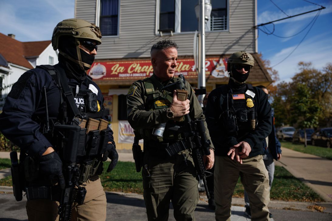 Bovino walks with other agents while conducting an immigration enforcement sweep in Chicago's Brighton Park neighborhood on November 6, 2025.