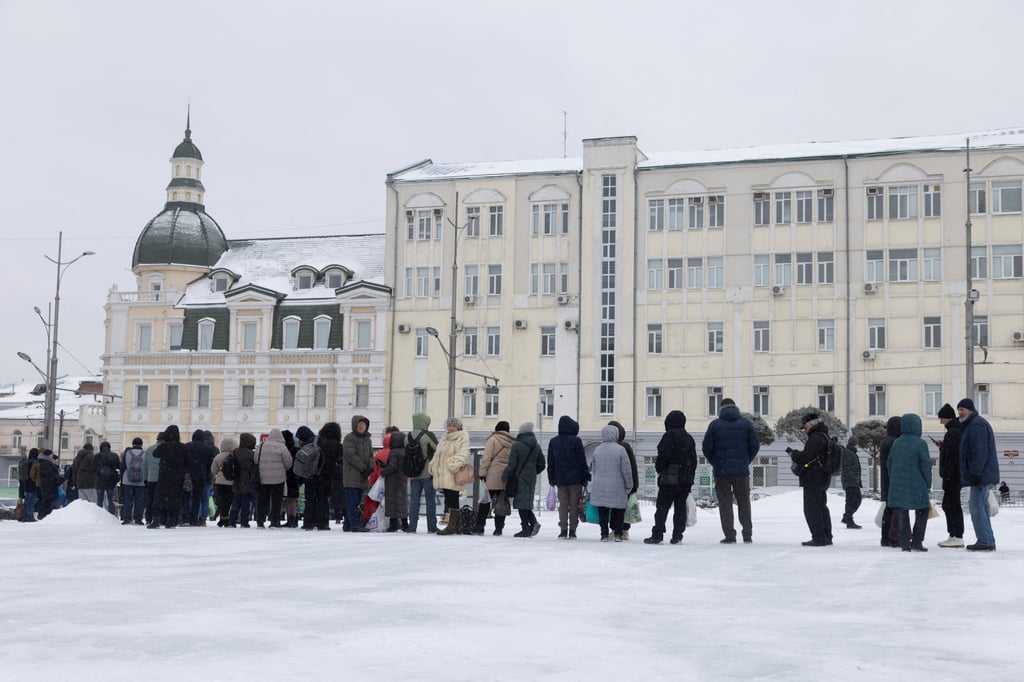 People line up at a bus stop during sub-zero temperatures in Ukraine’s Kharkiv on Saturday. Photo: Reuters
