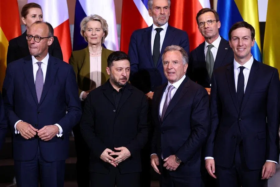 Ukraine's President Volodymyr Zelenskyy, US President Donald Trump's son-in-law Jared Kushner, US special envoy Steve Witkoff and German Chancellor Friedrich Merz gather for a family photo together with European Commission President Ursula von der Leyen, Denmark's Prime Minister Mette Frederiksen, Italian Prime Minister Giorgia Meloni and Dutch Prime Minister Dick Schoof, at the Chancellery in Berlin, Germany, on 15 December 2025. (Lisi Niesner/Reuters)