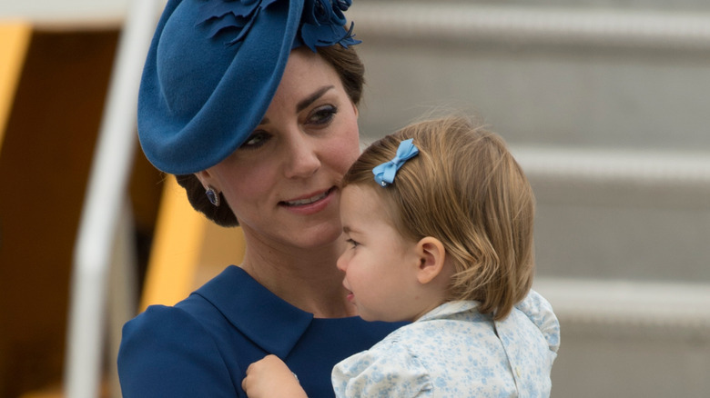Kate Middleton holds Princess Charlotte at Victoria Airport in 2016