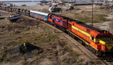 A train convoy with soldiers and VAMTACs of the Spanish Army from Greece to Romania