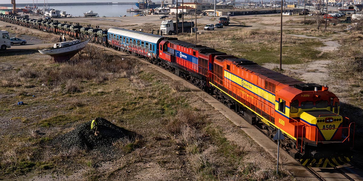 A train convoy with soldiers and VAMTACs of the Spanish Army from Greece to Romania