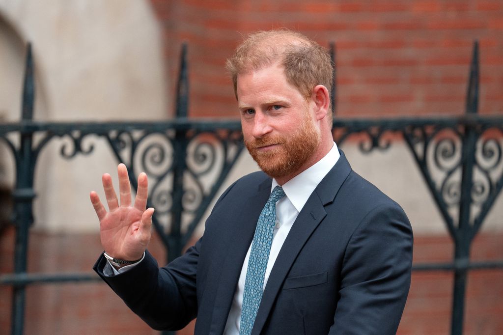 Prince Harry waving in suit