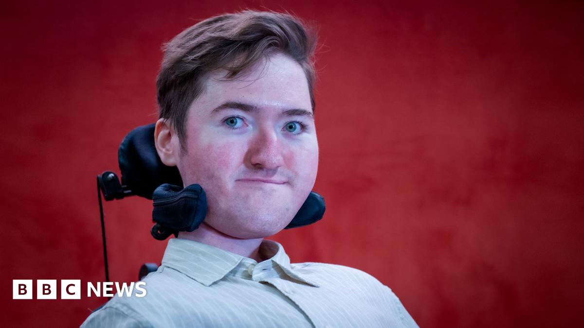Sian Kennedy, who has long blonde hair, holding her little girl Sienna. Both are smiling at the camera.