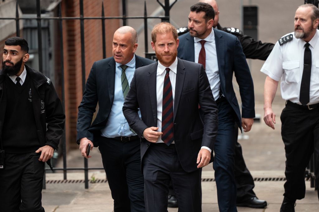 Prince Harry wearing a suit for arrival at court