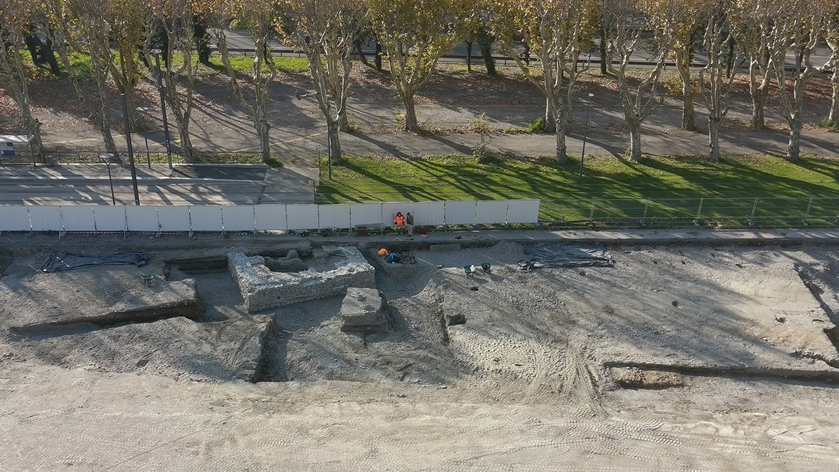 Aerial of archaeologists at site