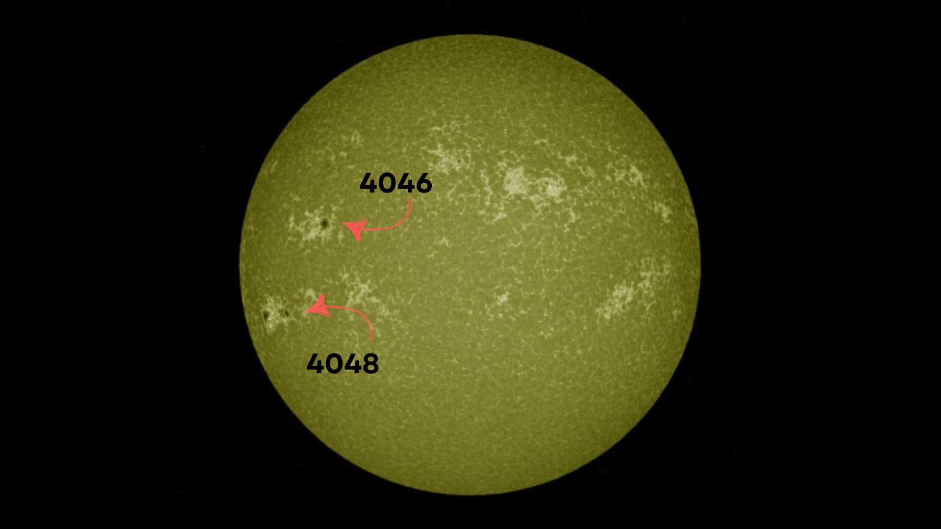 image of the sun with two large dark regions which are sunspots. They are labelled 4046 (the upper sunspot) and 4048 (the lower sunspot).