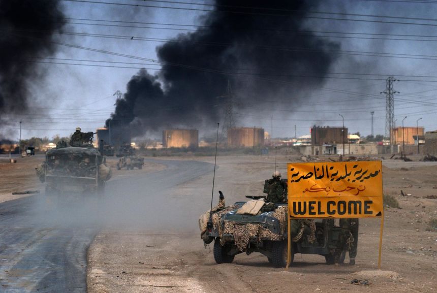US Marines from the 2nd Battalion 8th regiment enter in the southern Iraqi city of Nasiriyah, where allied troops found stuborn resistance in their northbound advance torwards the Iraqi capital Baghdad, on March 23, 2003.