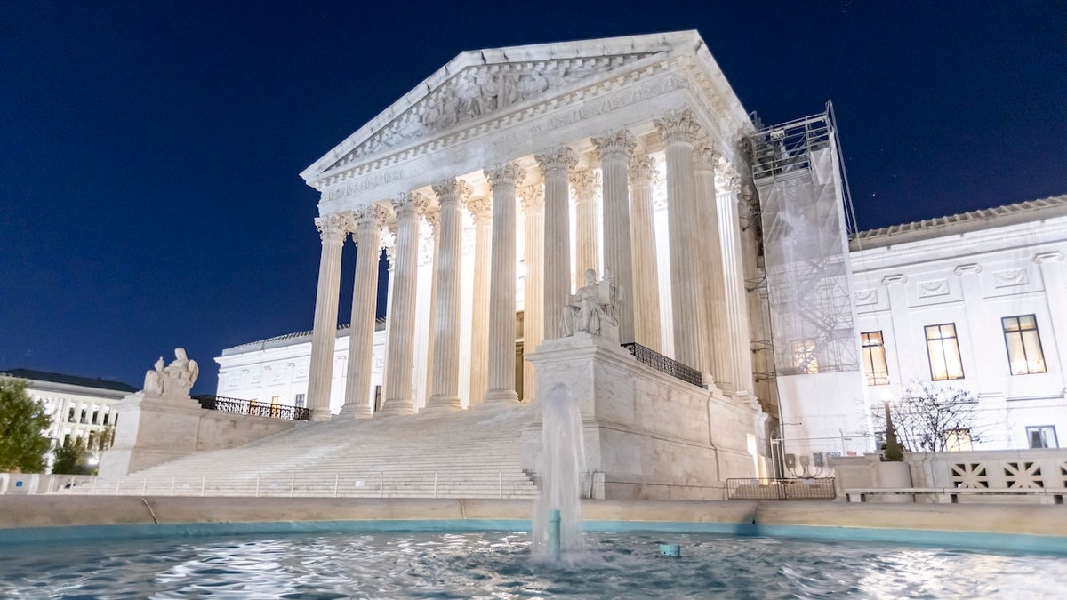 Night view of the Supreme Court of the United States known as SCOTUS in Washington D.C. with the round water fountain.The Main Entrance with lights, the West Facade with the marble Pediment and the inscription EQUAL JUSTICE UNDER LAW. The Supreme Court Building illuminated during the night. The historical building houses the Supreme Court of the United States, referred to as The Marble Palace, the building serves as the official workplace of the Chief Justice of the United States and the eight associate justices of the Supreme Court. It is located at 1 First Street in Northeast Washington, D.C., in the block immediately east of the United States Capitol and north of the Library of Congress. The building is managed by the Architect of the Capitol and is designated a National Historic Landmark The Supreme Court is the highest court in the federal judiciary of the United States. It has ultimate appellate jurisdiction over all federal court cases, and over state court cases that involve a point of U.S. Constitutional or federal law. Washington DC, USA on November 8, 2024 (Photo by Nicolas Economou/NurPhoto via Getty Images)