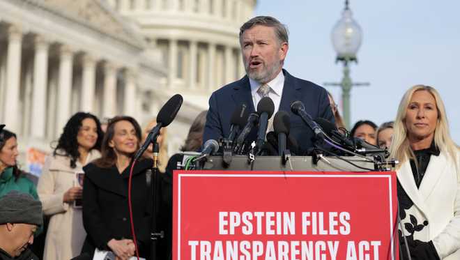 WASHINGTON, DC - NOVEMBER 18: U.S. Rep. Thomas Massie (R-KY) speaks alongside U.S. Rep. Marjorie Taylor Greene (R-GA) (R) during a news conference on the Epstein Files Transparency Act outside the U.S. Capitol on November 18, 2025 in Washington, DC. The House is expected to vote today on the legislation, which instructs the U.S. Department of Justice to release all files related to the late accused sex trafficker Jeffrey Epstein. (Photo by Heather Diehl/Getty Images)
