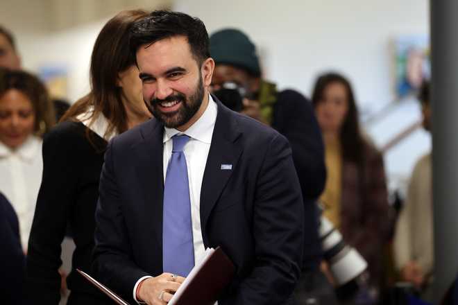NEW YORK, NEW YORK - DECEMBER 17: Mayor-elect Zohran Mamdani tours a Brooklyn library before speaking to the media to make a transition announcement for his administration on December 17, 2025 in New York City. Jahmila Edwards will be the head of the Mayor's Office of Intergovernmental Relations and Cat Da Costa will become the head of the Mayor's Office of Appointments. Upon taking office, the incoming administration will seek to address a $380 million budget deficit.  (Photo by Spencer Platt/Getty Images)