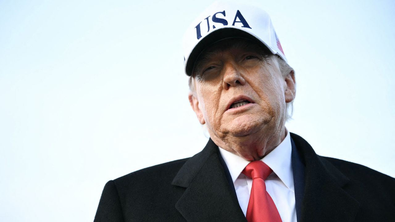 US President Donald Trump speaks to the press upon returning to Joint Base Andrews in Maryland on January 13, 2026. Trump is returning from speaking to The Detroit Economic Club in Detroit, Michigan, and a visit to a Ford production plant. (Photo by Mandel NGAN / AFP via Getty Images)