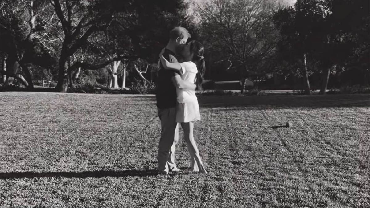 Harry and Meghan kiss in video 