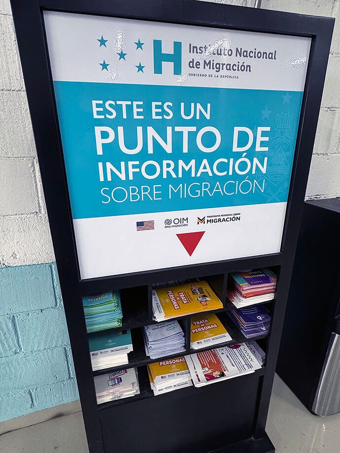 A shelf displaying information for migrants is sponsored by United Nations international immigration programs and the U.S. embassy. Photo by the Rev. Gustavo Vasquez, UM News.