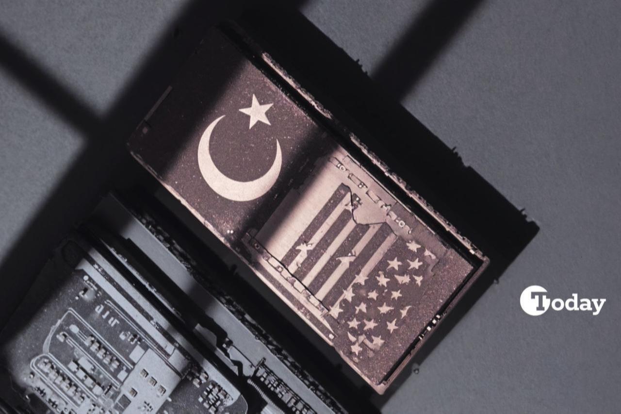 The image is a stylized photograph of an AI chip, featuring laser-etched designs of the American and Turkish flags.