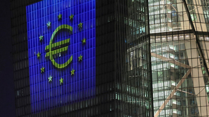 The euro symbol and yellow stars are illuminated on the European Central Bank’s main building to celebrate Bulgaria adopting the euro.