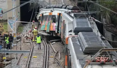 A trainee driver was killed when a wall crashed on to his cab in Catalonia in heavy rain