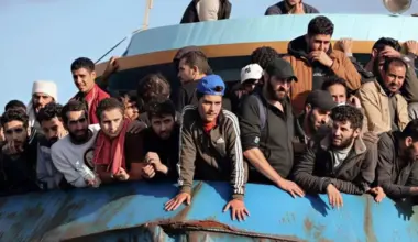 rescued refugees and migrants stand aboard a boat at the town of paleochora southwestern crete island on november 22 2022 following a rescue operation photo afp