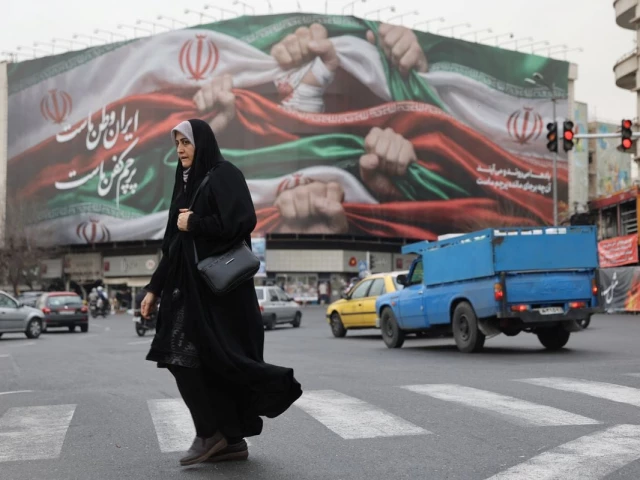 an iranian woman walks on a street in tehran iran january 19 2026 photo wana reuters