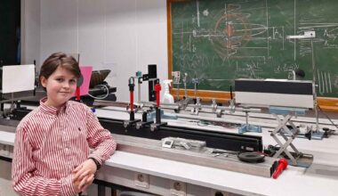 Laurent Simons stands in a physics lab at the University of Antwerp, the teen researcher now pursuing AI-driven medical science to study aging.