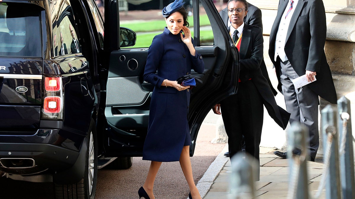 Meghan, Duchess of Sussex arrives ahead of the wedding of Princess Eugenie of York and Jack Brooksbank at St George’s Chapel, Windsor Castle, near London, England, Friday Oct. 12, 2018. (Gareth Fuller/Pool via AP)