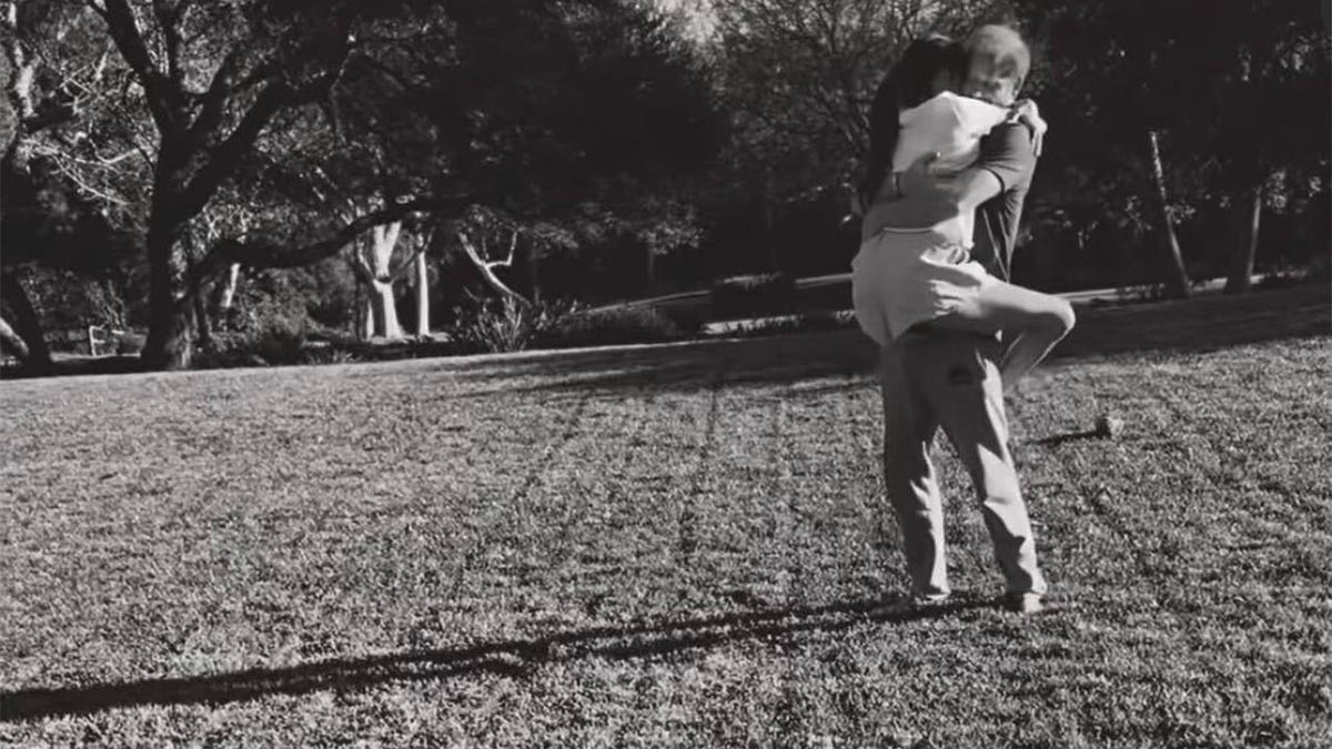 Harry carried Meghan as she wrapped her legs around his waist