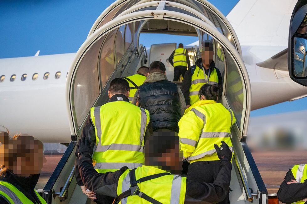 Migrants being placed onto returns flight