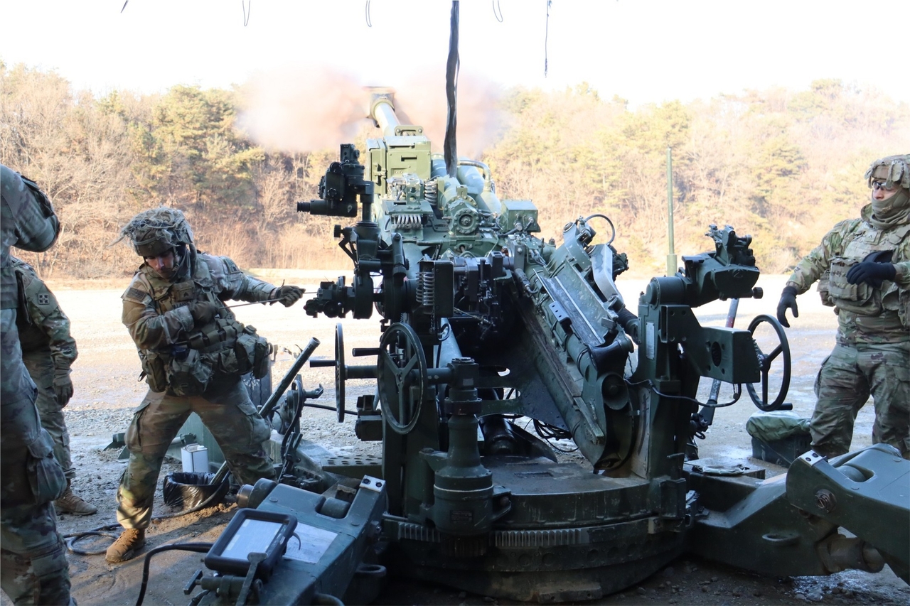 This photo, distributed on Dec. 29, 2025, shows US forces firing an M777 towed howitzer during a combined artillery live-fire drill. (Joint Chiefs of Staff-Yonhap)