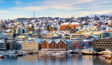 Snow-covered colourful houses in Norway
