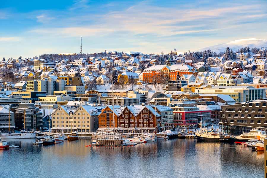 Snow-covered colourful houses in Norway