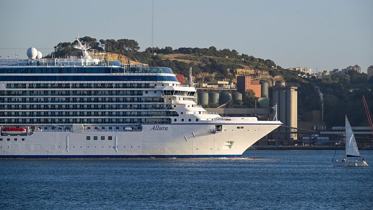 Oceania Allura cruise ship sails down the Tagus River after leaving the cruise terminal on September 16, 2025, in Lisbon, Portugal.