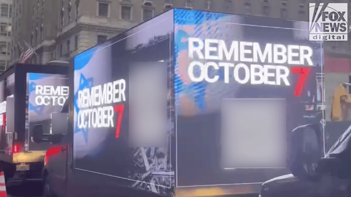 October 7 campaign trucks on city street